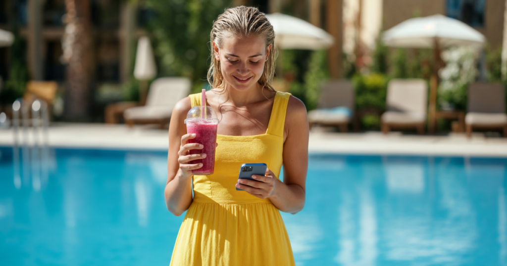 Woman holding phone in pool